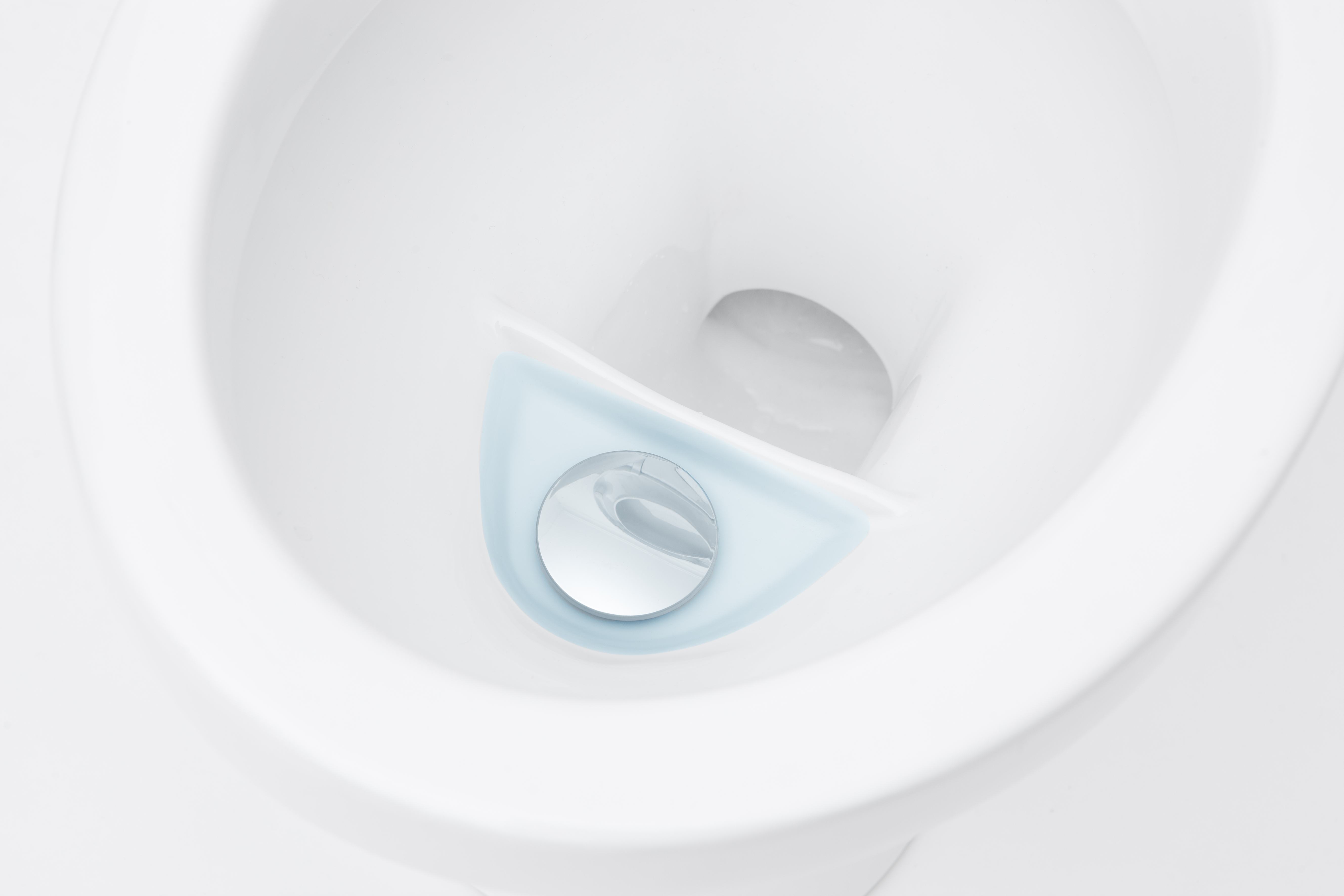 the inside of the wostman eco-flush toilet bowl showing the two different compartments